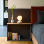 Ceramic wake light lamp pair, on a bedside table