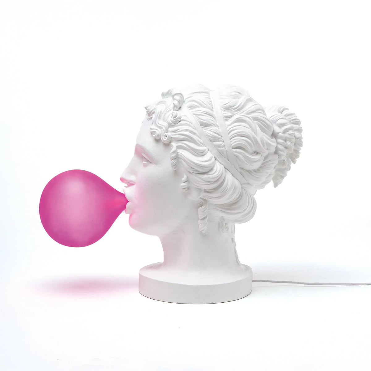 Classical bust table lamp with a pink bubblegum bubble, side view