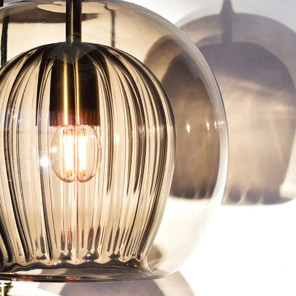 Clear or amber glass globe pendant, close-up of the fluted inner glass