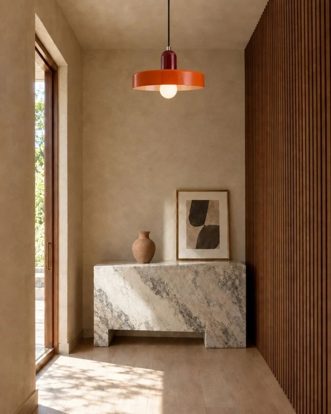 Two-tone disc pendant light, in red and orange in a hallway