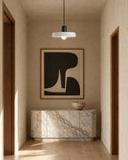 Two-tone disc pendant light, in white and green in a hallway