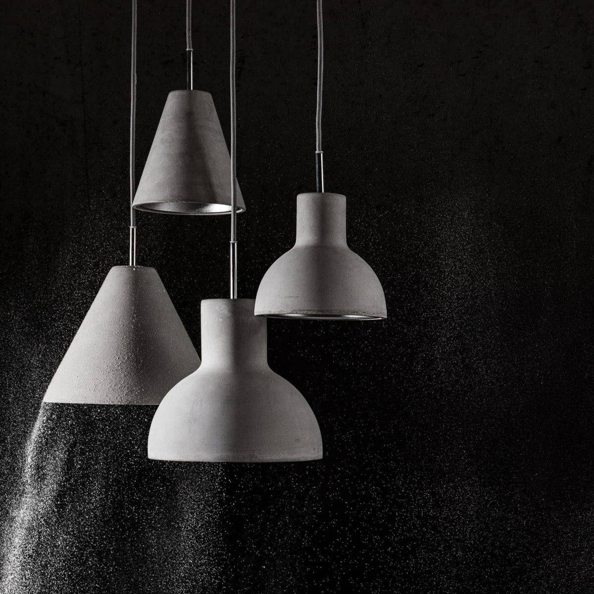 Concrete bell pendant, with other concrete shades
