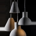 Concrete cone pendant, grouped with other concrete shades