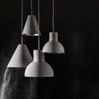Concrete cone pendant, with other concrete shades