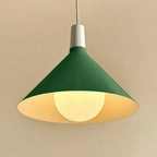 Medium dark green steel pendant with matt white globe bulb, close-up of the shade interior with the lit bulb