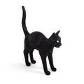 Cordless black cat table lamp with glowing eyes, arched back, tail raised