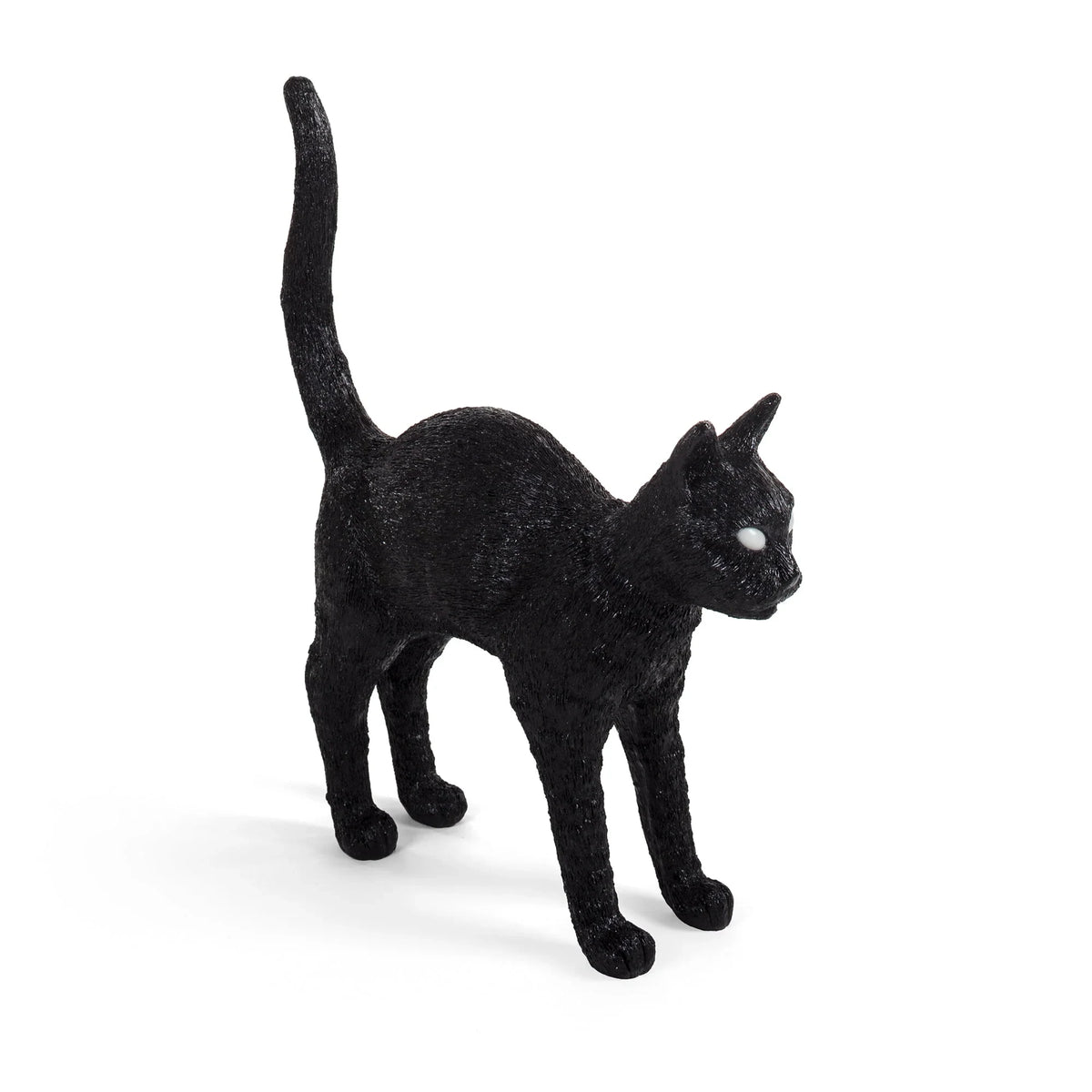Cordless black cat table lamp with glowing eyes, arched back, tail raised