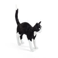 Cordless black and white cat table lamp with glowing eyes, arched back, tail raised