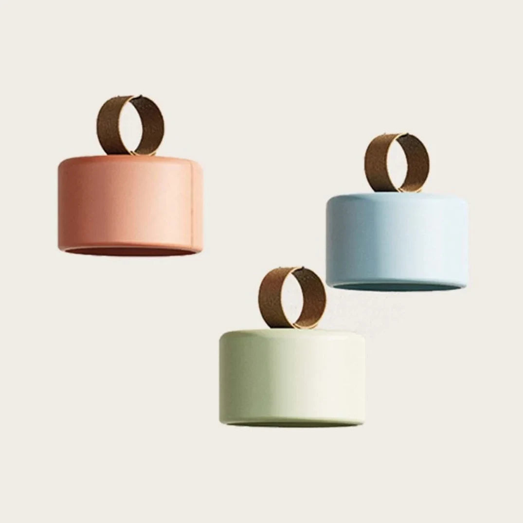 Cordless ceramic drum table lamp with leather ring handle, in coral, pale blue and sage green