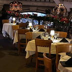 Cordless pleated shade table lamp, lit on a restaurant table