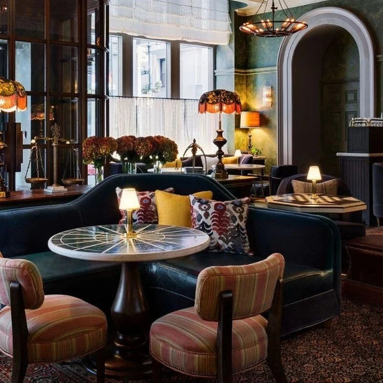 Cordless pleated shade table lamp, lit on a restaurant table