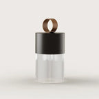 Cordless fluted glass table lamp, with a black ceramic cap, front view