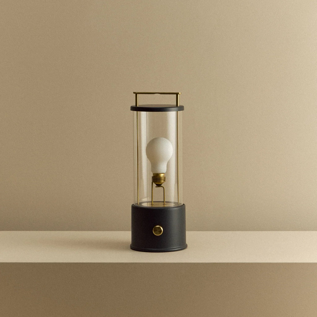 Cordless lantern lamp, black finish, unlit, on a plain ledge