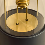 Cordless lantern lamp, black finish, close-up of the bulb holder and brass plate