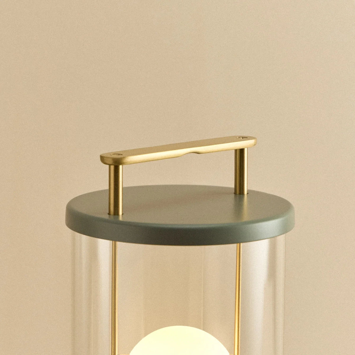 Cordless lantern lamp, green finish, close-up of the handle and top