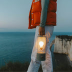 Cordless lantern lamp, green finish, carried by the sea