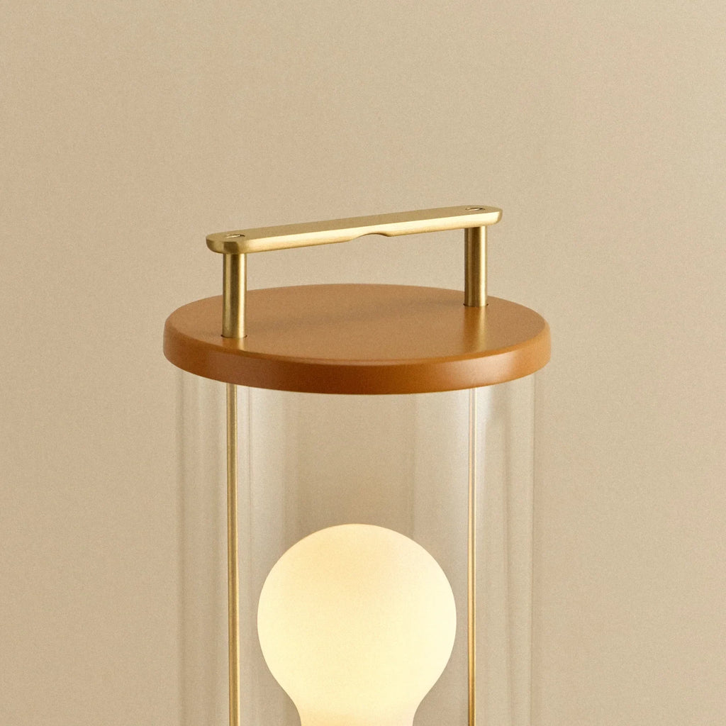 Cordless lantern lamp, orange finish, close-up of the handle and top
