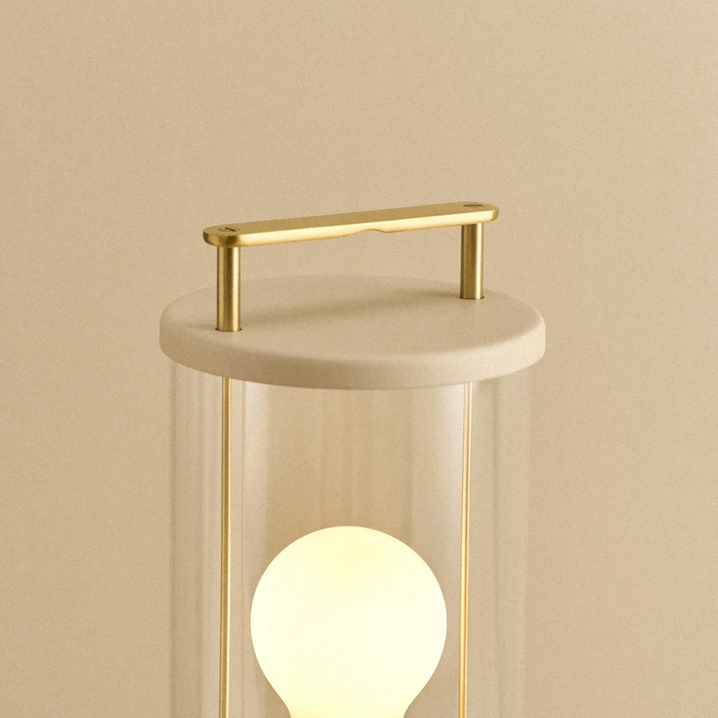 Cordless lantern lamp, plaster pink finish, close-up of the handle and top