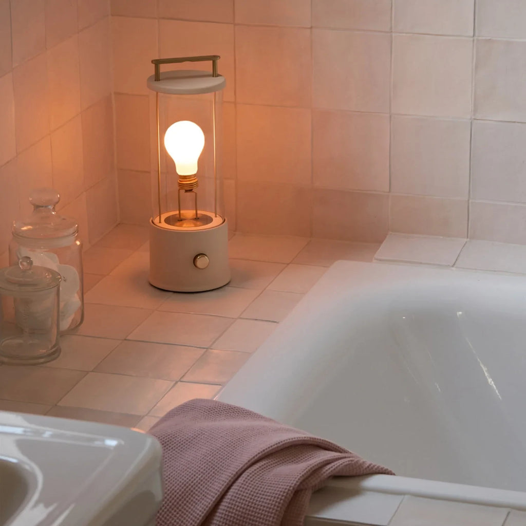 Cordless lantern lamp, plaster pink finish, by a bath