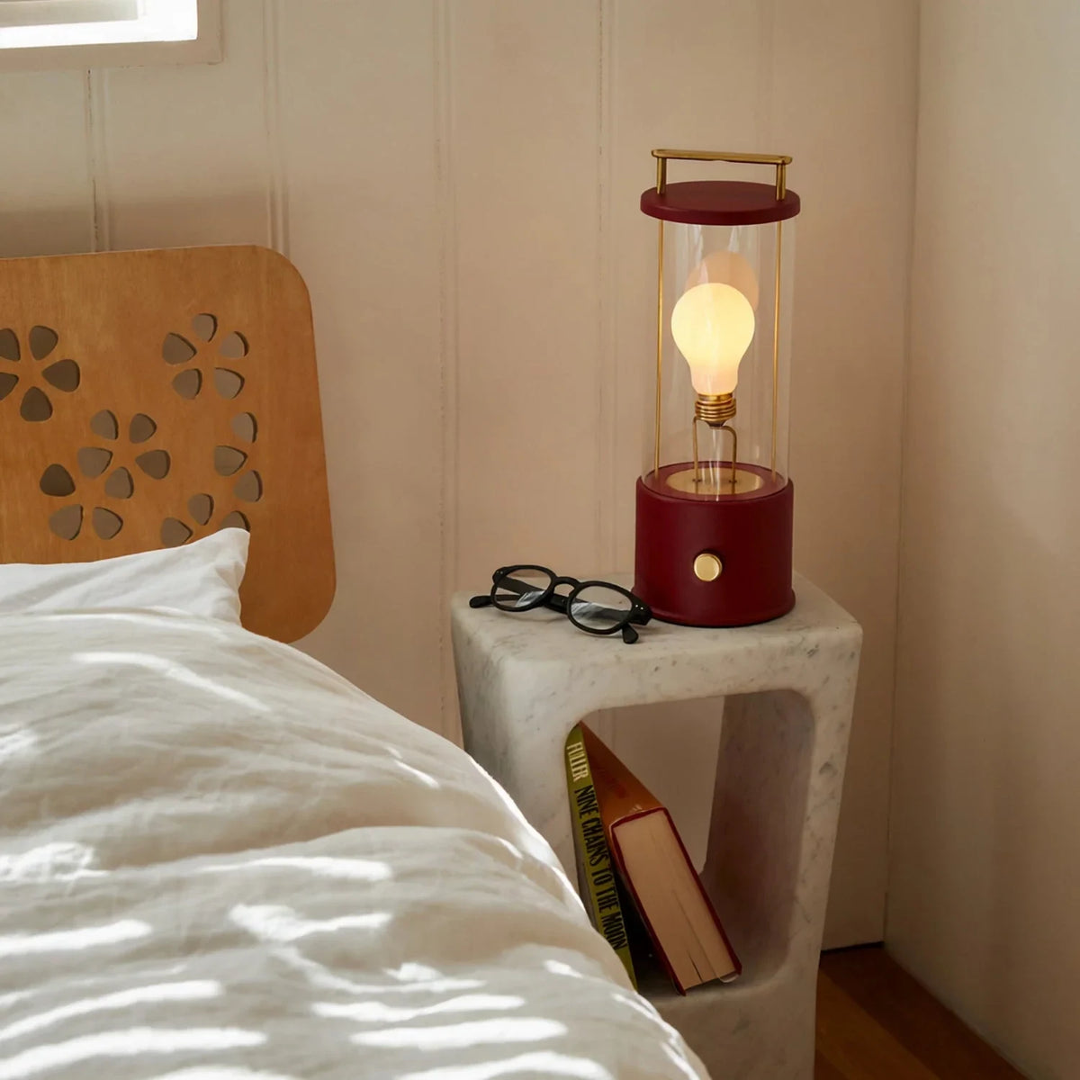 Cordless lantern lamp, red finish, on a bedside stand