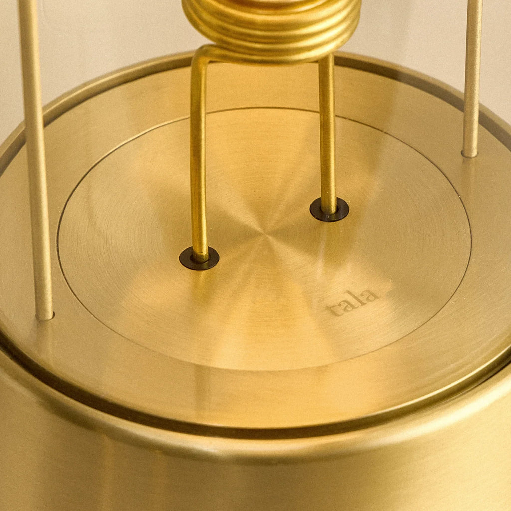 Cordless lantern lamp, solid brass, close-up of the bulb holder and base plate