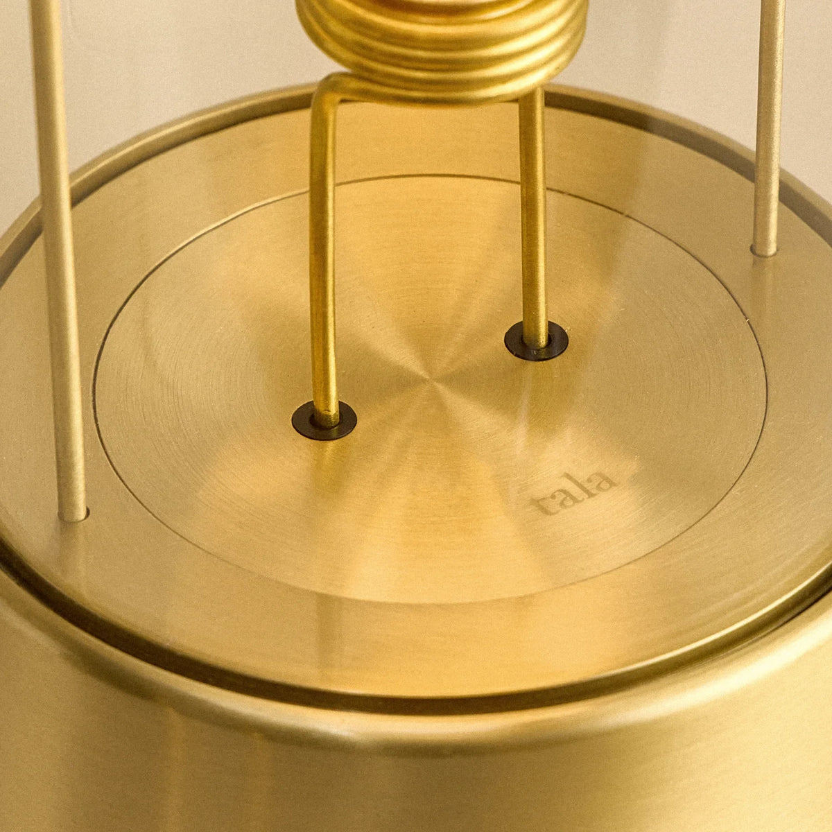 Cordless lantern lamp, solid brass, close-up of the bulb holder and base plate