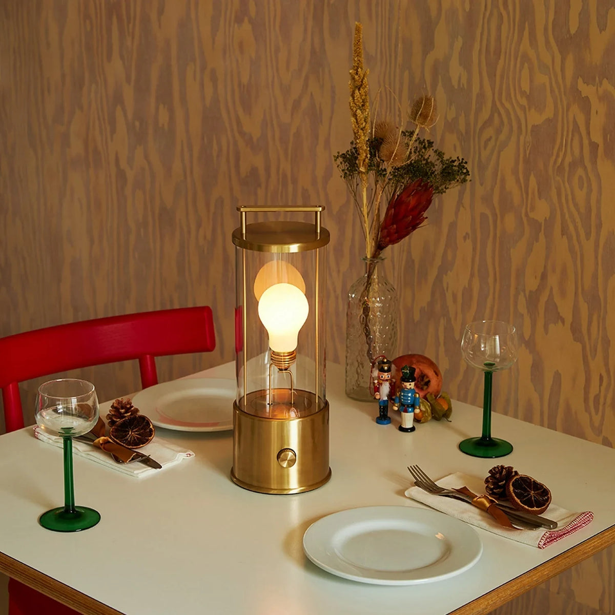 Cordless lantern lamp, solid brass, on a dining table