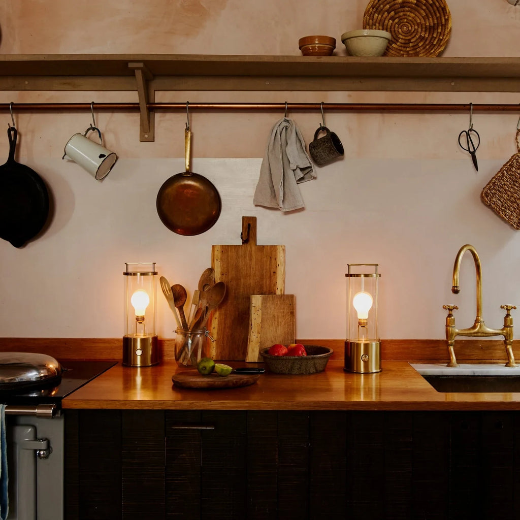 Cordless lantern lamp, solid brass, two on a kitchen worktop