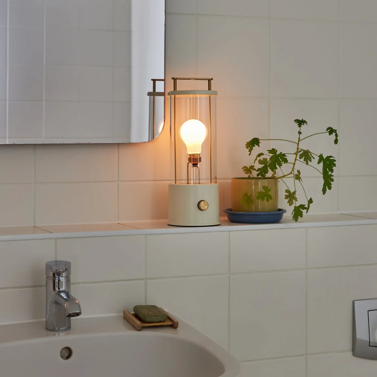 Cordless lantern lamp, white finish, on a bathroom shelf