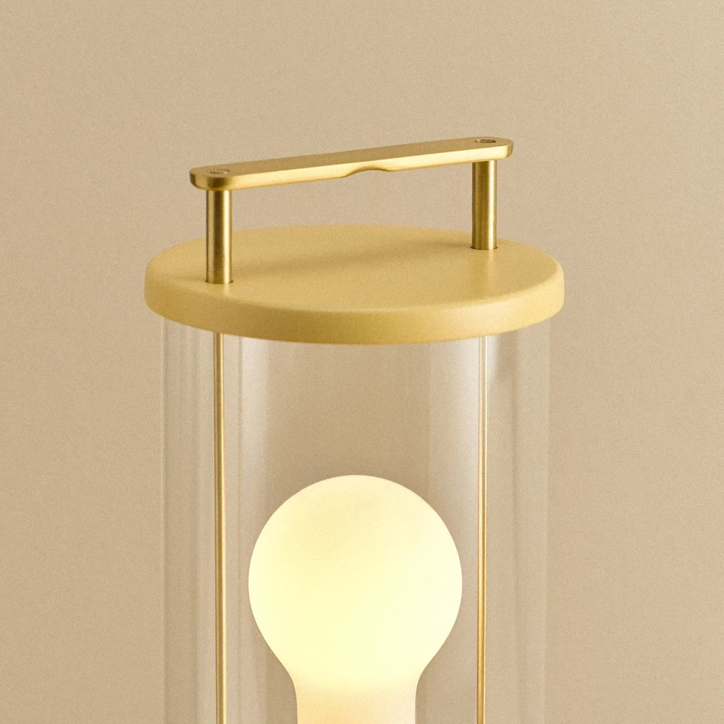 Cordless lantern lamp, yellow finish, close-up of the handle and top