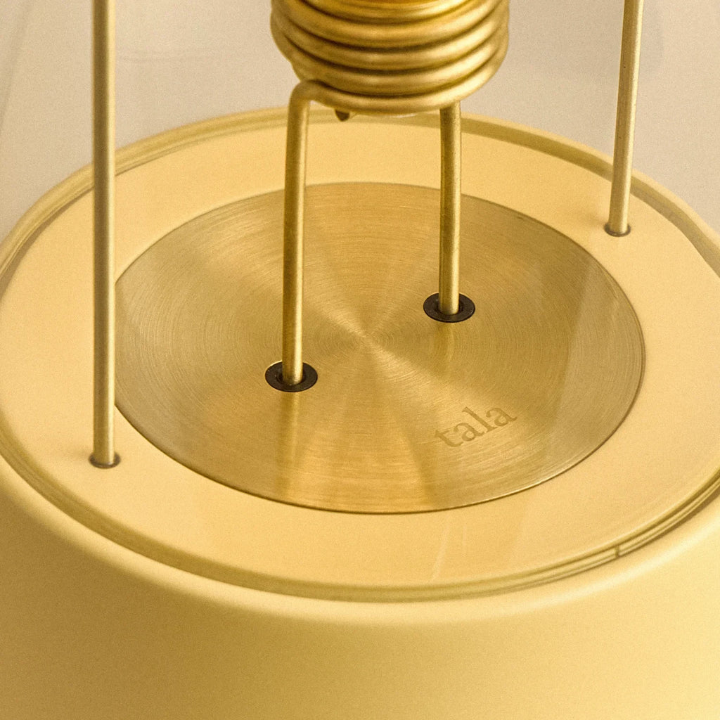 Cordless lantern lamp, yellow finish, close-up of the bulb holder and brass plate