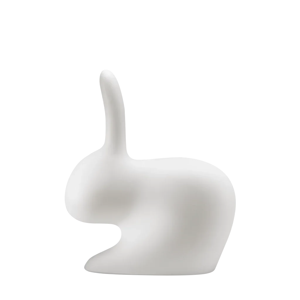 Cordless rabbit-shaped table lamp and seat, translucent, side view, lit