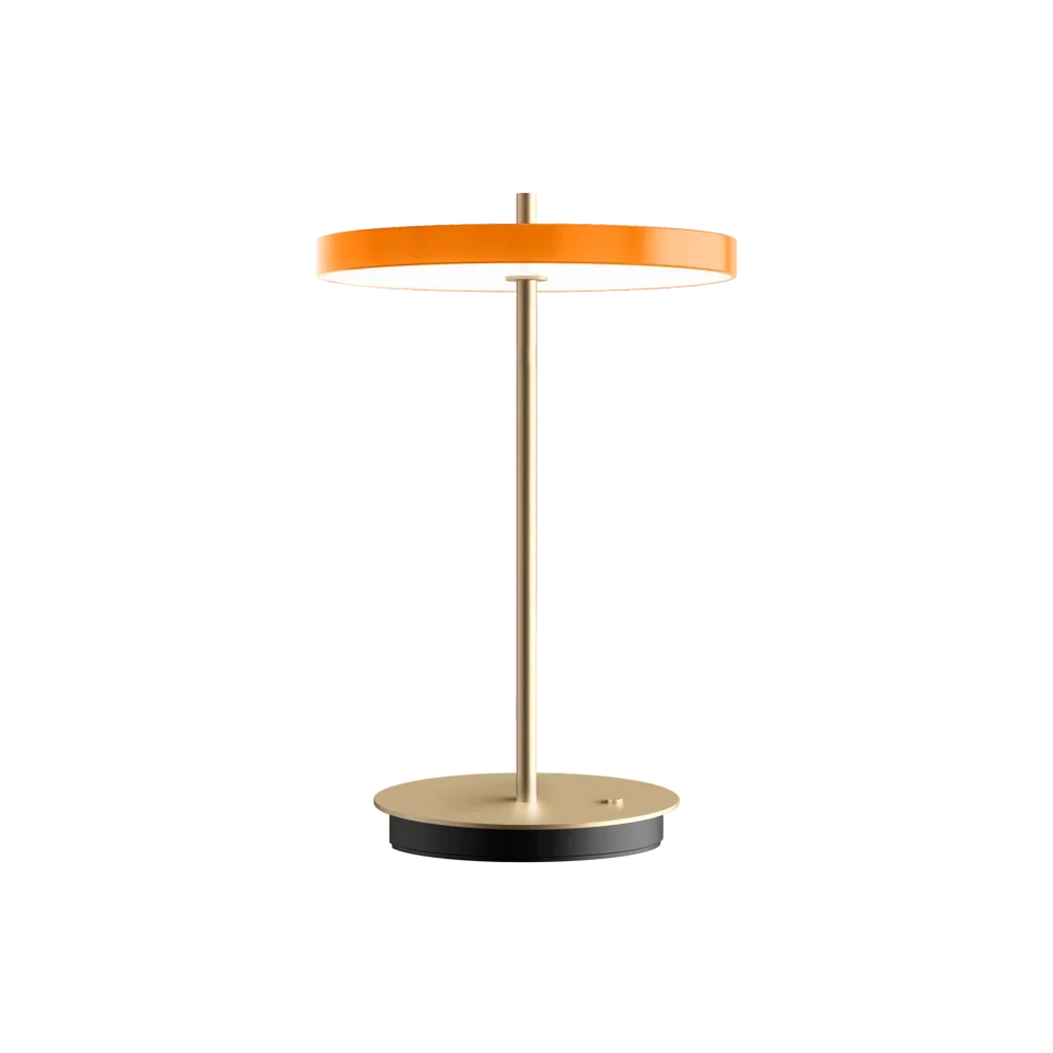 Cordless rechargeable LED table lamp, brass base, in orange, front view