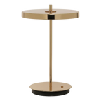 Cordless rechargeable LED table lamp, brass base, close-up of the polished brass shade