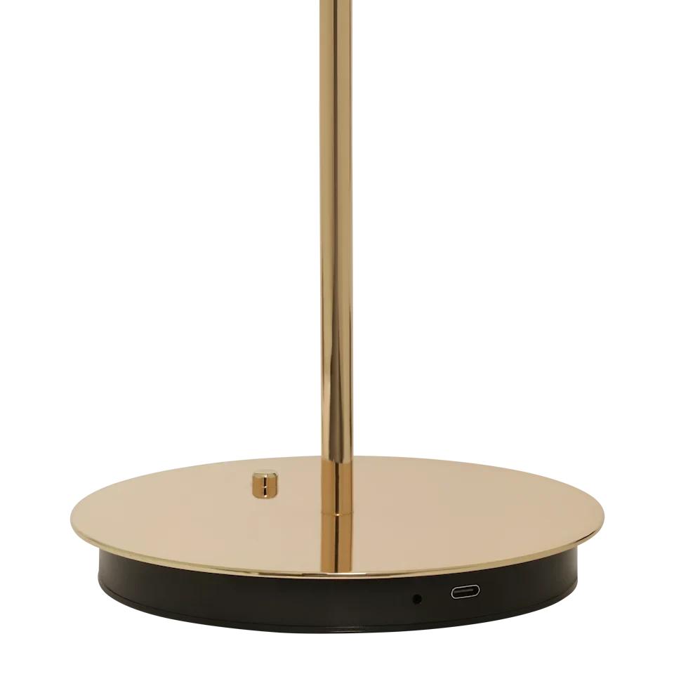 Cordless rechargeable LED table lamp, brass base, close-up of the brass base