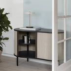 Cordless rechargeable LED table lamp, brass base, in use at home