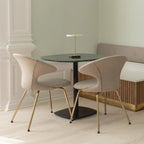 Cordless rechargeable LED table lamp, brass base, in use at home