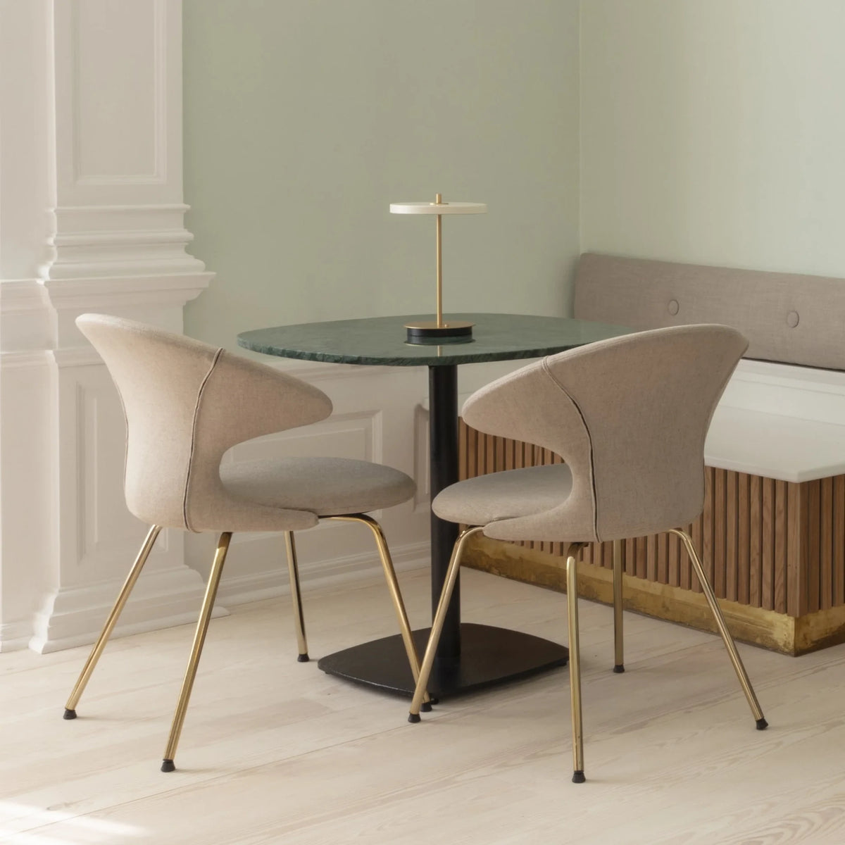 Cordless rechargeable LED table lamp, brass base, in use at home