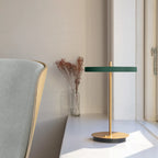 Cordless rechargeable LED table lamp, brass base, in use at home