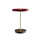 Cordless rechargeable LED table lamp, brass base, in ruby red