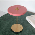 Cordless rechargeable LED table lamp, brass base, in use at home