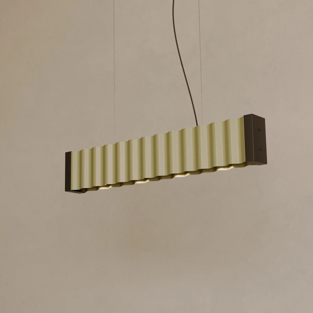 Corrugated linear bar pendant, with gold-tone sheets, lit
