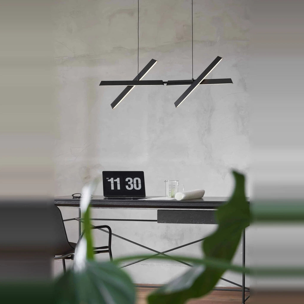 Crossed bar linear LED pendant, above a desk
