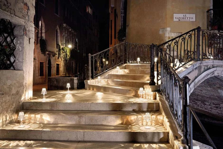 Crystal-effect rechargeable table lamp, lit along outdoor steps at night