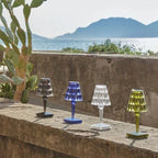 Crystal-effect rechargeable table lamp, four colours on a wall by the sea