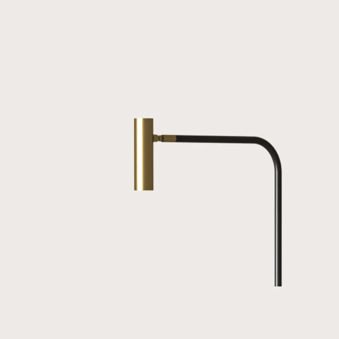 Curved-arm task floor lamp, close-up of the matte brass head
