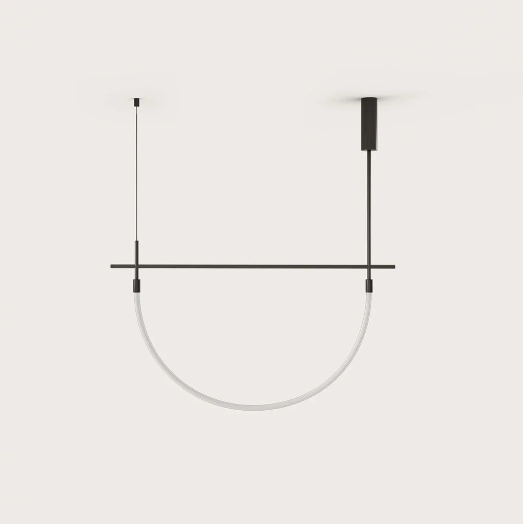 Curved opal tube linear LED pendant, on a plain background
