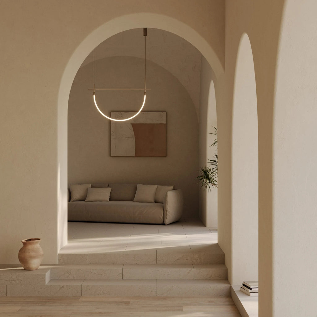 Curved opal tube linear LED pendant, in an arched hallway