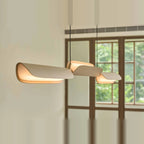 Curved shade linear LED pendant, close-up in oatmeal