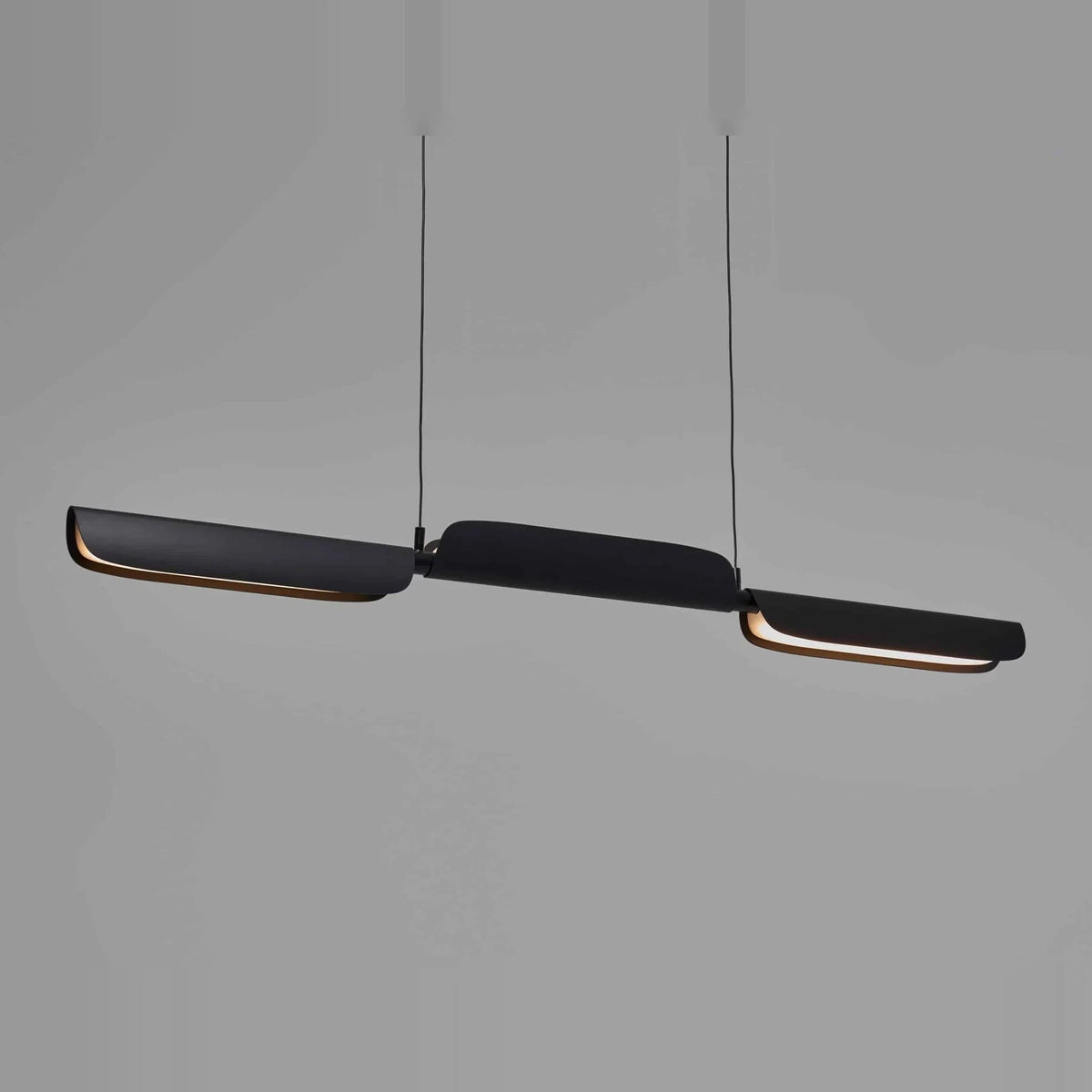 Curved shade linear LED pendant, in black, shades turned